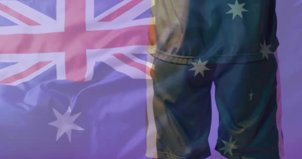 オーストラリアの国旗の上に白人男性サッカー選手のアニメーション グローバル愛国心 お祝い スポーツ デジタルインターフェイスの概念デジタル生成ビデオ — ストック動画