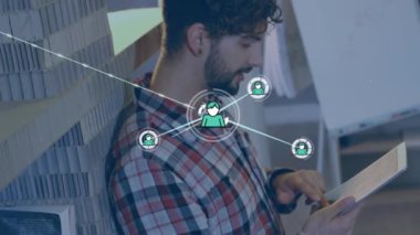 Animation of network of connections over caucasian businessman in office. Global business and digital interface concept digitally generated video.