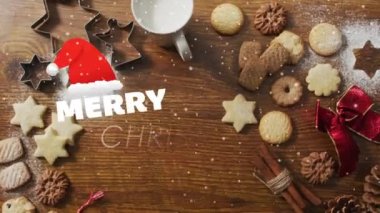 Noel kurabiyeleri ve ahşap arka plandaki dekorasyonlarla ilgili mutlu noel mesajlarının animasyonu. Noel, gelenek ve kutlama konsepti dijital olarak oluşturuldu.