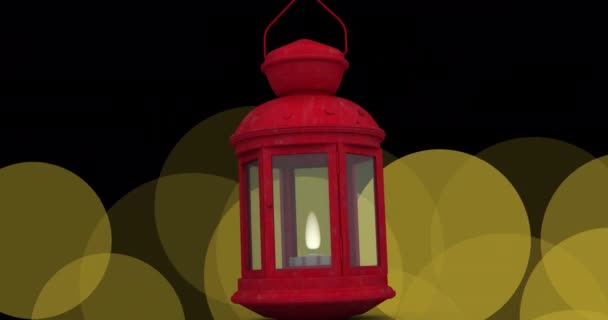 黒い背景に浮かぶ黄色の光の上に吊るされた赤いランプのアイコンのアニメーション クリスマスのお祭りとお祝いのコンセプト — ストック動画