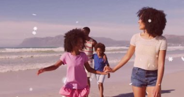 Çiftler üzerine yağan Noel karı animasyonu. Kızları ve oğlu plajda. Noel, aile, gelenek, kutlama ve bayram konsepti dijital olarak oluşturulmuş video.