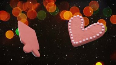 Karların düşüşü ve Noel perilerinin ışıkları üzerine zencefilli kurabiye animasyonu. Noel, şenlik, gelenek ve kutlama konsepti dijital olarak oluşturuldu.