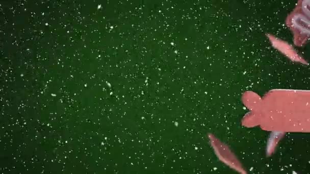 Κινούμενα Σχέδια Χριστουγεννιάτικων Μπισκότων Νιφάδες Χιονιού Που Πέφτουν Πράσινο Φόντο — Αρχείο Βίντεο