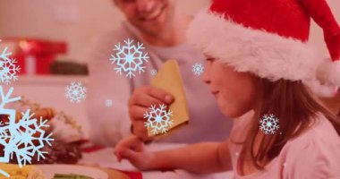 Noel yemeğinde babasıyla birlikte beyaz kızın üzerine düşen kar tanelerinin animasyonu. Noel, şenlik, kutlama ve gelenek konsepti dijital olarak oluşturuldu.