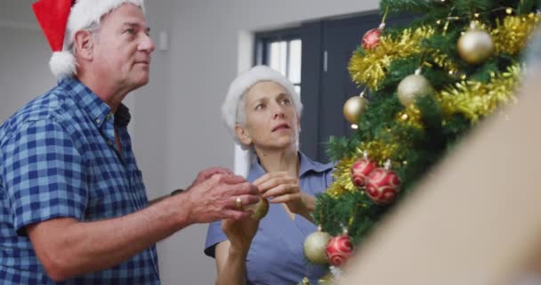 Animation Merry Christmas Text Senior Caucasian Couple Wearing Santa Hats — Stock Video