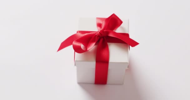High Angle Video White Gift Box Tied Red Ribbon White — Stock Video