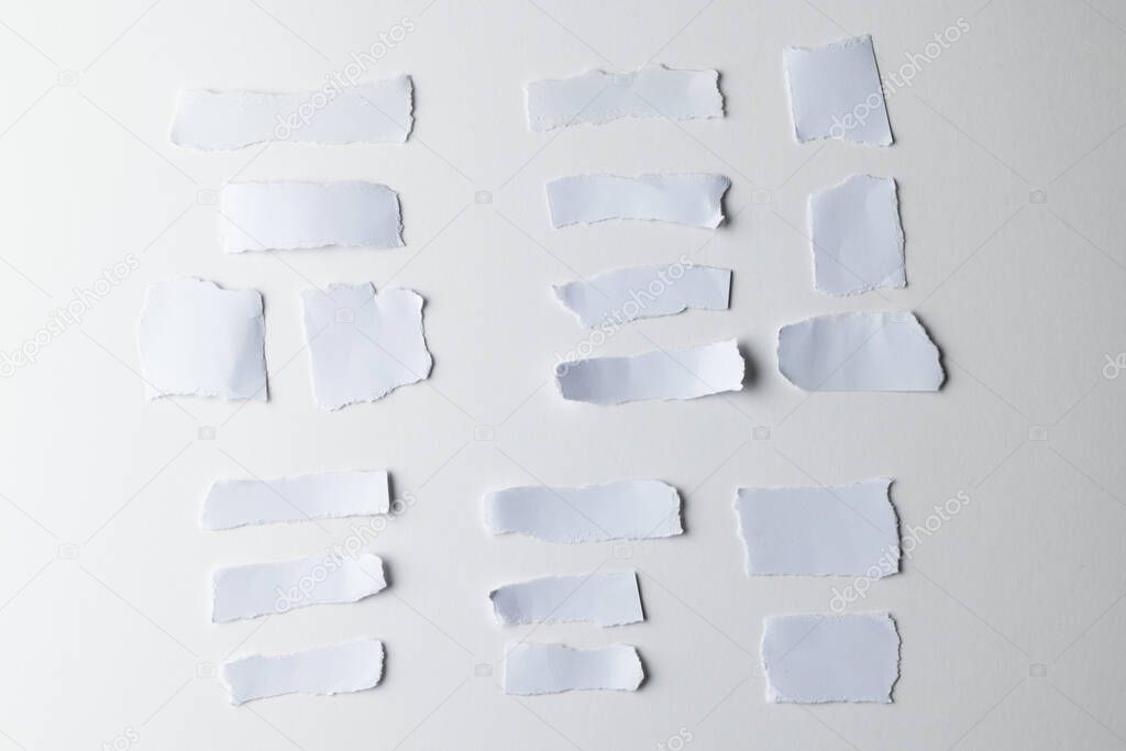 Ripped up pieces of white paper with copy space on white background. Abstract paper texture background and communication concept.