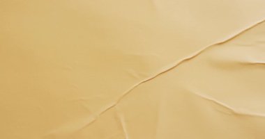 Kopya alanı olan sarı kırışık kumaşın yakın çekim videosu. Kumaş, doku ve malzeme kavramı.