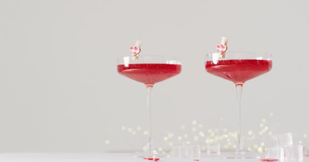 Video Red Drinks Two Cocktail Glasses Heart Shapes White Background — Stock Video