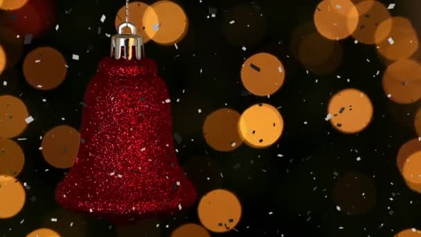 ライトアップされたレンズフレアと赤いクリスマスの鐘の上に落ちるコンフェッティのアニメーション デジタル生成 クリスマスのお祭り ベクトルと休日の概念 — ストック動画