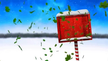 Yeşil yaprakların üzerindeki animasyon, karla kaplı kırmızı tahta tabelanın üzerine düşüyor. Noel, şenlik, kutlama ve gelenek konsepti dijital olarak oluşturuldu.