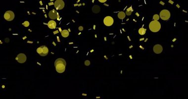 Konfeti animasyonu ve siyah arka planda hareket eden sarı ışık lekeleri. Desen, ışık ve hareket kavramı dijital olarak oluşturulmuş video.