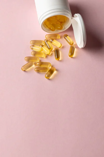 Vertical Composition White Pill Box Spilling Oil Capsules Pink Background — Stock Photo, Image