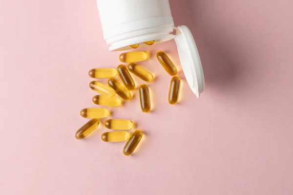 Composition White Pill Box Spilling Oil Capsules Pink Background Copy — Stock Photo, Image