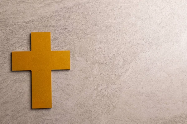 stock image Image of close up of yellow wooden cross and copy space on grey background. Christianity, religion and faith concept.