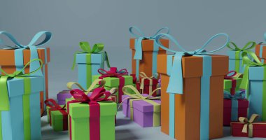 Çok renkli yılbaşı resimlerinde gri arka planda kurdeleler var. Noel, şenlik, gelenek ve kutlama kavramı.