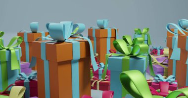 Çok renkli yılbaşı resimlerinde gri arka planda kurdeleler var. Noel, şenlik, gelenek ve kutlama kavramı.