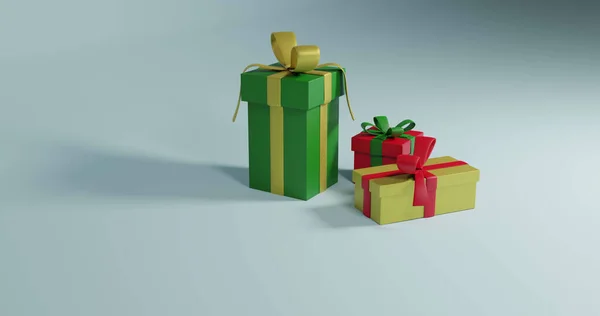 3つのクリスマスプレゼントのイメージは灰色の背景にコピースペースで回転しています クリスマス お祭り お祝いのコンセプト — ストック写真