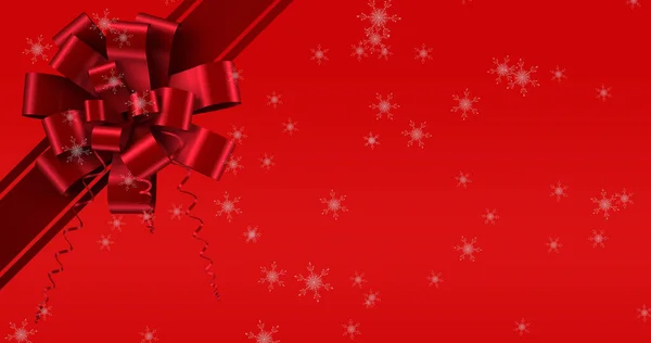 赤い背景のリボンの上に降る雪のイメージ クリスマス お祝いのコンセプトをデジタルで — ストック写真