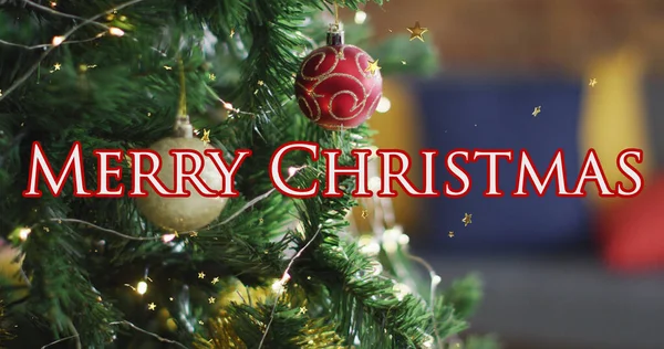 Merry christmas text banner and golden star icons floating against decorated christmas tree. christmas festivity and celebration concept