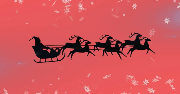 Afbeelding Van Kerstman Slee Met Rendieren Sneeuw Vallen Rode Achtergrond — Stockfoto