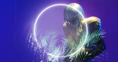 Aydınlatılmış çember ve bitkilerin birleşimi mavi arka planda duran Amerikan futbolcusunun üzerinde. Boşluğu, sporu, rekabeti, illüstrasyonu, parıltıyı, doğayı, şekli ve soyut kavramı kopyala.