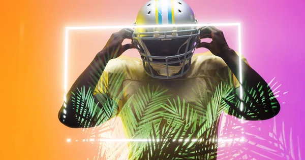 照明された長方形の形状と植物によってヘルメットを身に着けているアメリカのサッカー選手の複合体 スポーツ イラスト アフリカ系アメリカ人と形状の概念 — ストック写真
