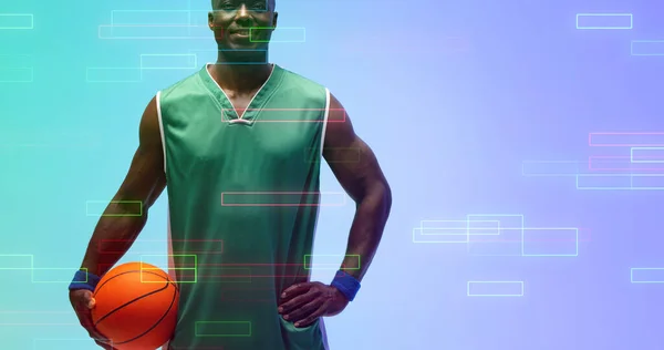 Счастливый Африканский Американский Баскетболист Держит Мяч Подсвеченными Прямоугольниками Синем Фоне — стоковое фото