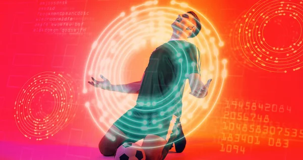 Caucasian Young Soccer Player Kneeling Neon Design Computer Codes Background — Stock Photo, Image