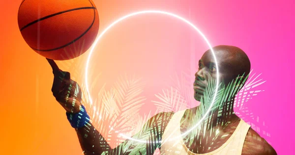 Лысый Африканский Баскетболист Крутит Мяч Пальце Освещенными Кругами Растениями Копирование — стоковое фото