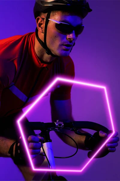 Caucasian Male Athlete Wearing Helmet Eyewear Riding Bike Illuminated Hexagon — Stock Photo, Image