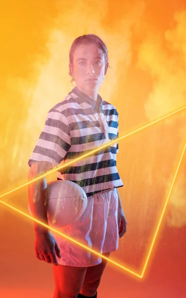 Confident Female Caucasian Player Holding Ball Standing Illuminated Triangle Amidst — Stock Photo, Image