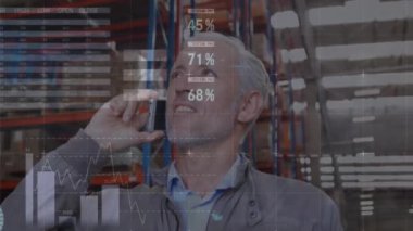 Animation of data processing over caucasian businessman talking on smartphone. Global business, finances and digital interface concept digitally generated video.