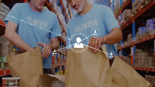 Анимация Сети Профильных Икон Над Двумя Разнообразными Волонтерами Мужского Пола — стоковое видео