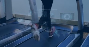 Animation of data processing over woman running on treadmill, exercising in gym. Global sports, fitness, computing and data processing concept digitally generated video.