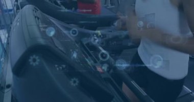 Animation of data processing over people running on treadmill, exercising in gym. Global sports, fitness, computing and data processing concept digitally generated video.