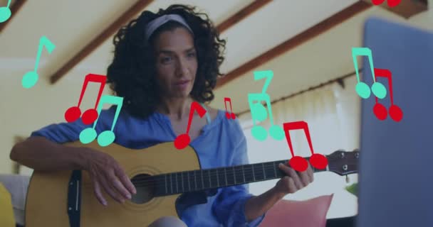 Animation Music Notes Biracial Woman Playing Guitar Using Lapotp Music — Vídeo de Stock