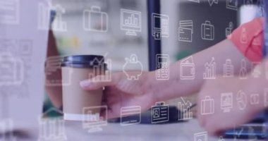 Animation of business icons over hands giving coffee. Global business and digital interface concept digitally generated video.