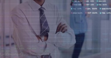 Animation of graphs, trading board on smiling african american man standing arms crossed in office. Digital composite, multiple exposure, stock market, report, business and investment concept.