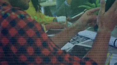 Animation of data processing over diverse business people in office. Global business and digital interface concept digitally generated video.
