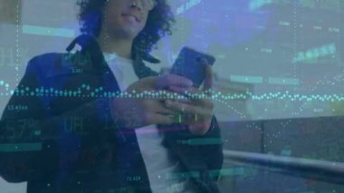 Animation of financial data processing over caucasian man using smartphone. Global shopping, business, finance, computing and data processing concept digitally generated video.