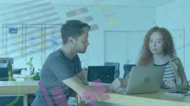 Animation of infographic interface over caucasian coworkers discussing strategy on laptop in office. Digital composite, multiple exposure, global, report, communication, teamwork and technology.