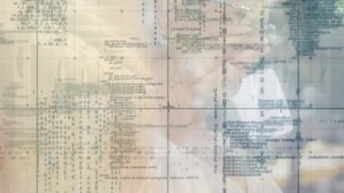 Animation of grid pattern over programming language against senior caucasian woman using laptop. Digital composite, multiple exposure, retirement, coding, machine learning and technology concept.