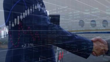 Animation of financial data processing over businessman handshake. Global business, finance, computing and data processing concept digitally generated video.