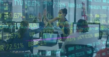 A group of office workers giving each other high fives and smiling. Global business connections digital interface and technology concept digitally generated video.