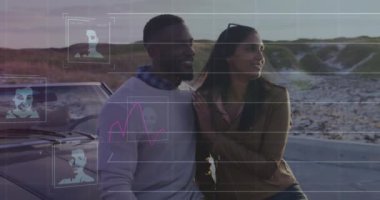 Animation of biometric photo and financial data processing over diverse couple by a car. Global business, finance and data processing concept digitally generated video.