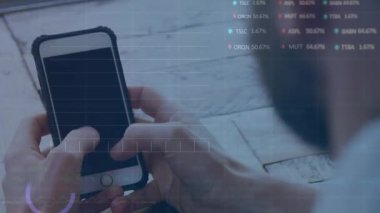 Animation of financial data processing over caucasian man using smartphone. Global shopping, business, finance, computing and data processing concept digitally generated video.