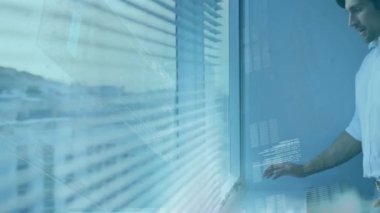 Animation of data processing over caucasian businessman in office. Global business and digital interface concept, digitally generated video.
