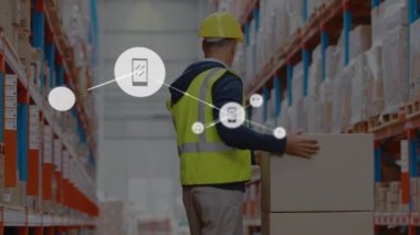 Animation of connected dots over caucasian male worker suffering from back pain while picking up box. Digital composite, multiple exposure, warehouse, communication, backache and distribution concept.