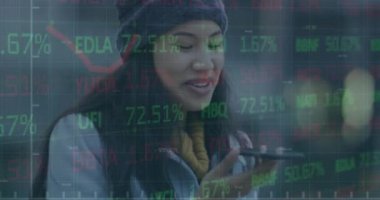 Animation of financial data processing over businesswoman using smartphone. Global business, finance, computing and data processing concept digitally generated video.